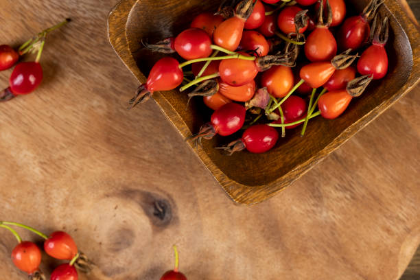 istock red rosehip fruits on a black tea table 2195816497