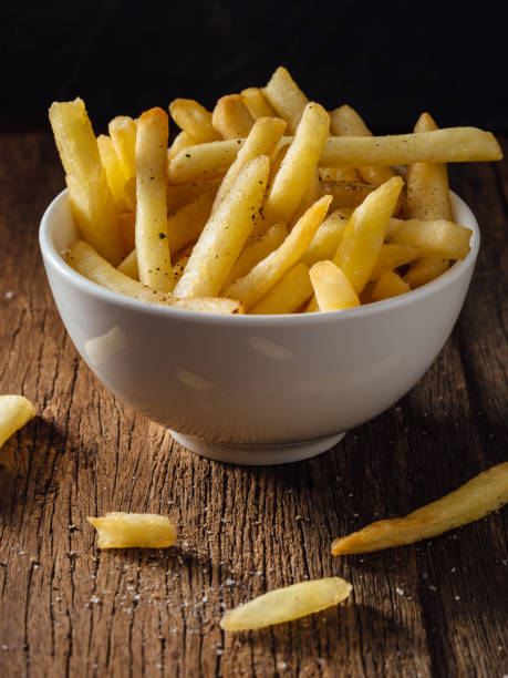 istock French fries on wooden background 2195816638