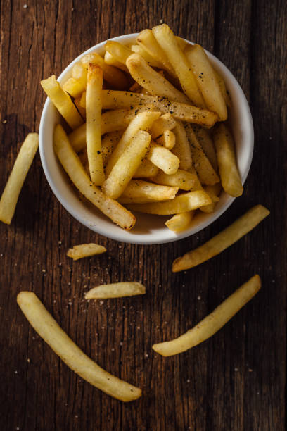 istock French fries on wooden background 2195816647