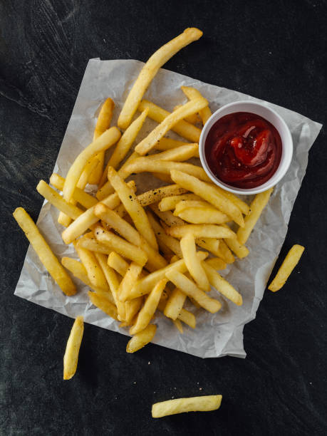 istock French fries on wooden background 2195816656