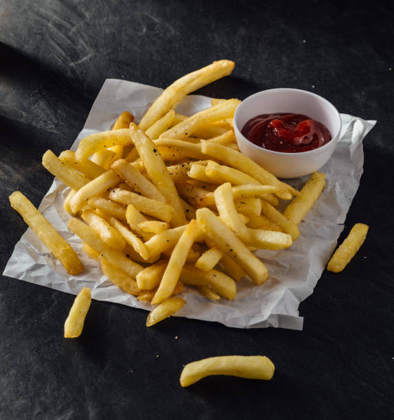 istock French fries on wooden background 2195816657