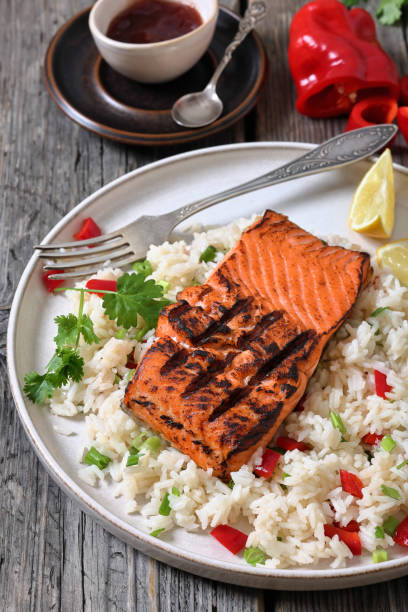 istock grilled red salmon fillet with rice, top view 2195817907