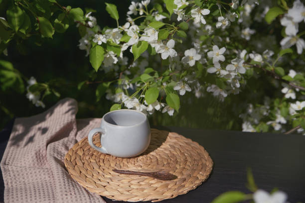 istock Relaxing tea time surrounded by blooming flowers in a serene setting 2195822168