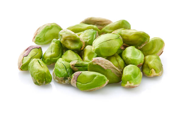istock Pistachio in closeup in white background 2195822263