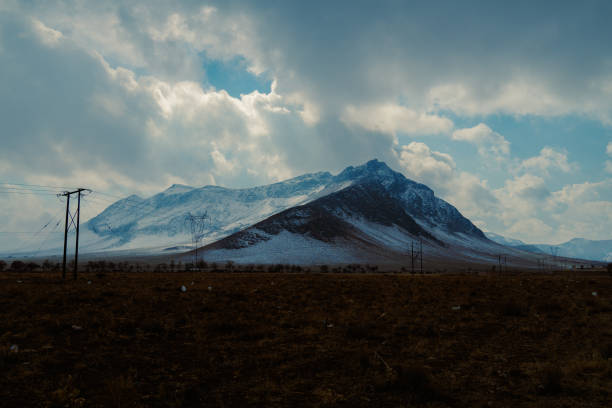 istock foggy mountain on the frozen field 2195822421