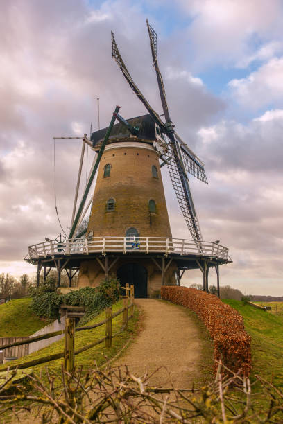 istock Historic Windmill De Windhond in Soest on a Cloudy Day 2195822459