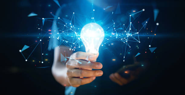 istock A hand holding a glowing light bulb surrounded by digital network connections, symbolizing innovation, technology, and creativity. 2195825885