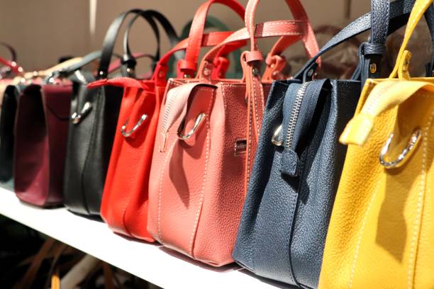 istock A Beautiful Array of Colorful Designer Handbags Artfully Displayed on a Stylish Shelf 2195833339