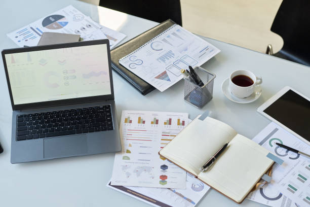 istock Documents on workplace of economist 2195835562