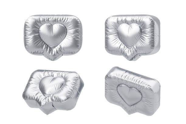 Metallic silver balloons shaped like speech bubbles with heart designs placed on a white background. Concept of love, celebration, social media. 3D Rendering.