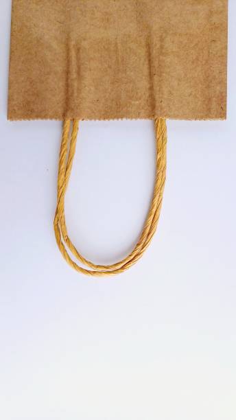 istock Brown paper packaging bag isolated on white background, wrapping. Paper gift wrap. 2195838064