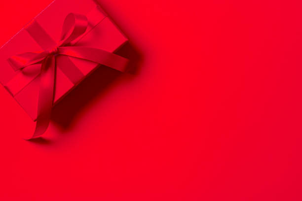 istock Red gift box on red background. Valentine's day. Birthday gift. Copy space 2195838214