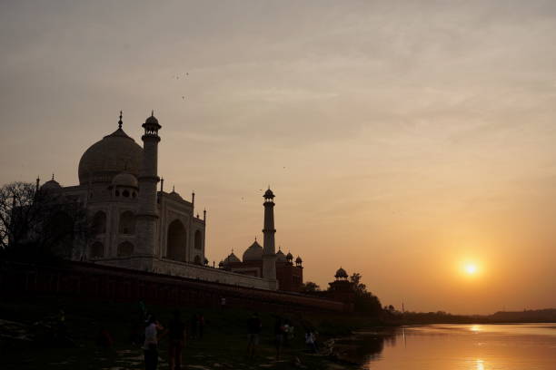 istock sunset near taj mahal, india, with birds 2195838713