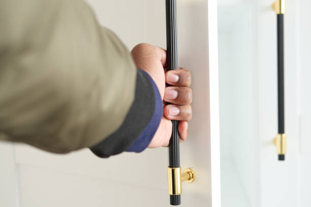 istock Hand Grasping a Modern Door Handle That Reflects Contemporary Design and Accessibility 2195841934
