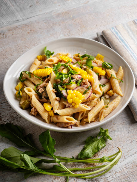 istock Penne pasta with tuna, corn and vegetable. Pasta salad with vegetables. Pasta salad with vegetables and tuna. 2195843965