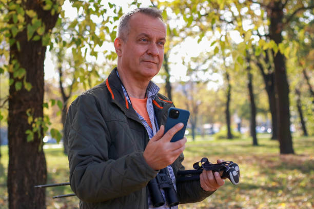 istock Senior businessman hiking and working online 2195845067