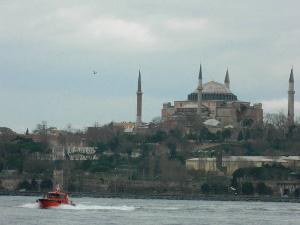 View of Hagia Sophia with red floating boat taken from Golden Horn