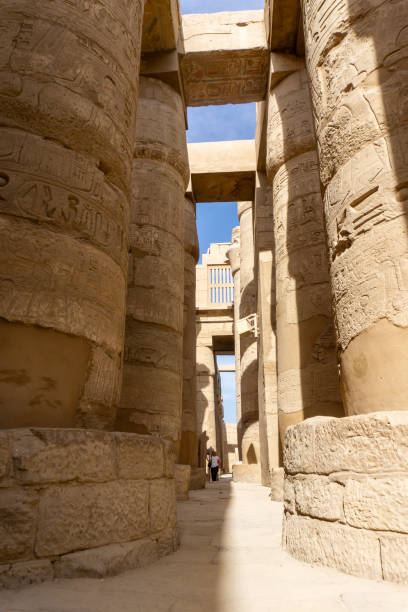 istock Massive Ancient Columns With Intricate Hieroglyphics Inside the Temple of Luxor Showcasing Egyptian Architectural Mastery 2195847306