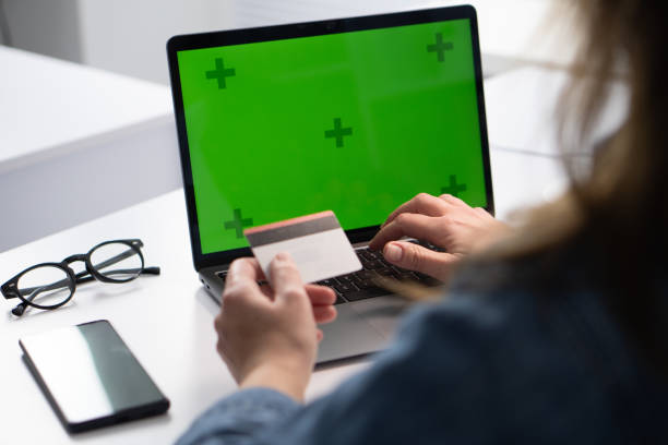 istock A person is actively engaged in the process of online shopping using a credit card while sitting at a laptop, taking advantage of the convenience and efficiency offered by modern technology 2195847381