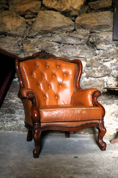 Elegant golden armchair surrounded by lush greenery in Caldas da Rainha, Portugal setting