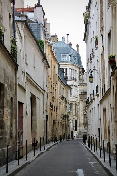 istock Narrow Parisian Street with Historic Architecture (Paris, France) 2195850004