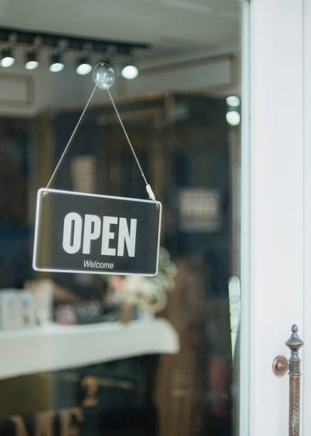 istock open sign hanging outside a restaurant, store, office or other 2195850102
