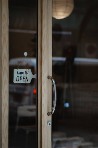 istock open sign hanging outside a restaurant, store, office or other 2195853319