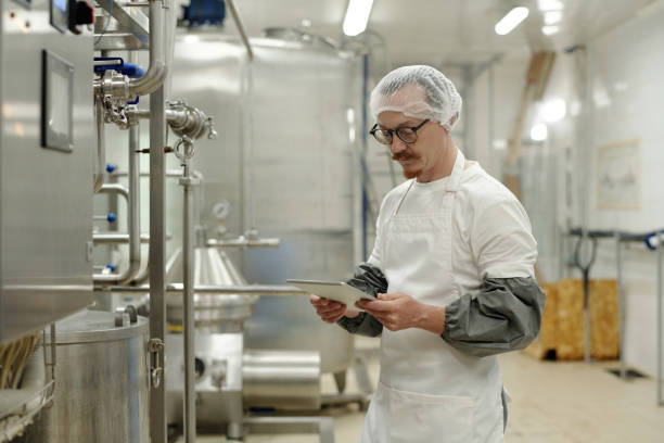 istock Inspecting Industrial Machinery in Sterling Sanitary Lab 2195859337