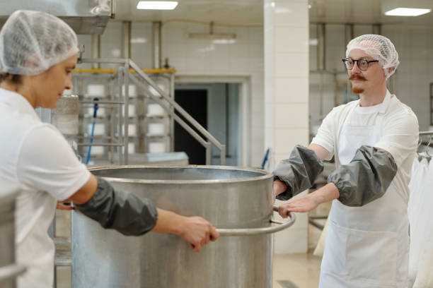 istock Men Preparing Food in Industrial Kitchen Setting 2195859390