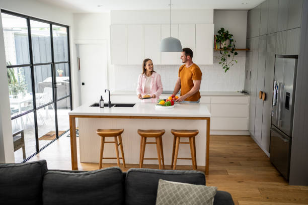 istock Happy couple in kitchen at home 2195859587