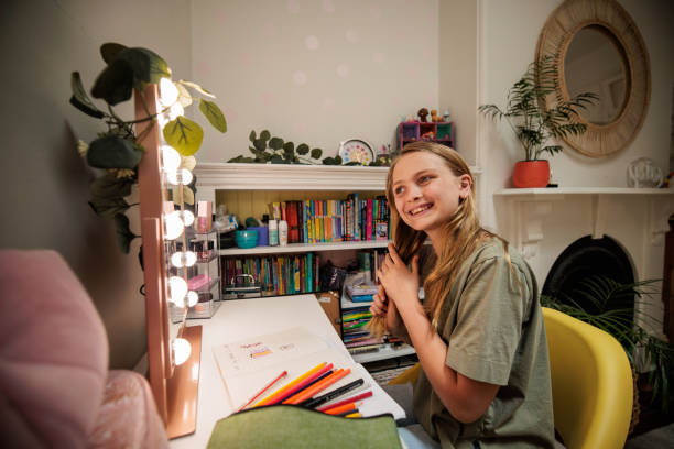 istock Young girl in her cozy room 2195860078