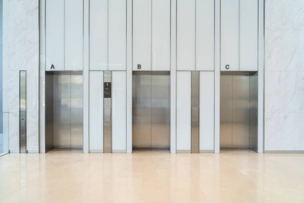 istock Row of modern stainless steel elevators in modern building 2195864046