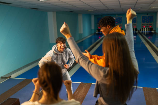 istock Friends having great time together in bowling club 2195864800