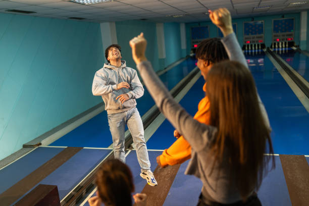 istock Friends having great time together in bowling club 2195865254