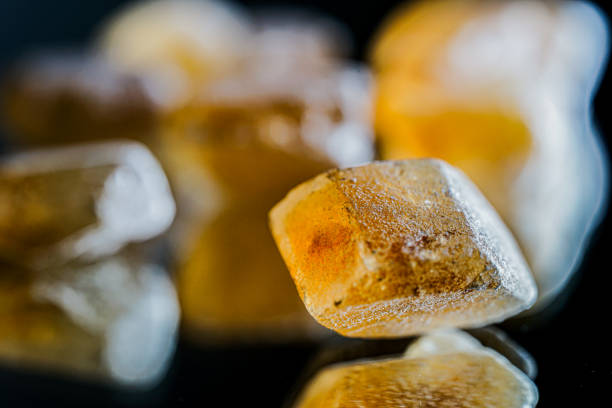 Detail of brown sugar rock candy kandis on a neutral background