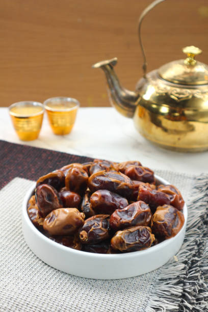 istock Sweet Dates and Golden Teapot: A Delightful Middle Eastern Scene 2195869753