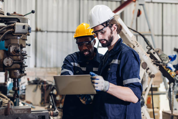 istock Workers Factory or Engineering work at factory site check up machine or products in site. Foreman or Technician checking Material or Machine on Plant. Heavy industry factory concept. 2195871056