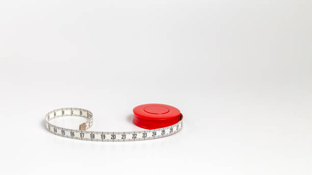istock A measuring tape lies on a white surface 2195872845