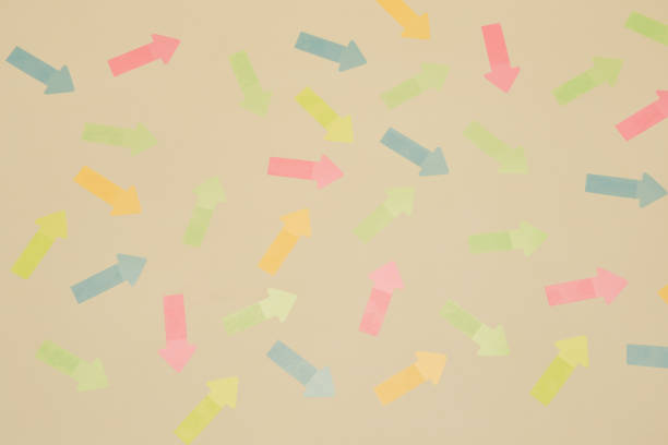 Pattern background texture with multitude of arrow stickers of different colors randomly pointing in different directions