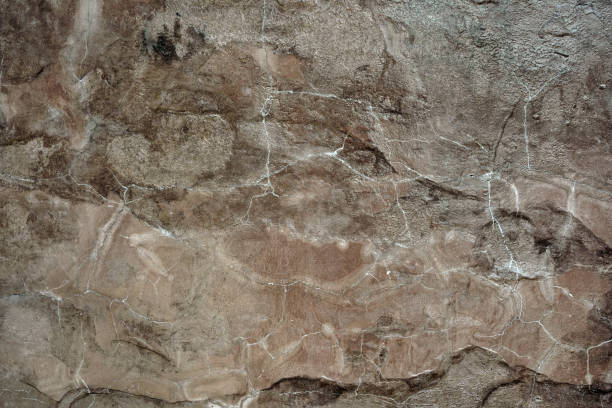 istock Empty cracked light brown natural stone wall on cave for abstract background and texture. beautiful patterns, space for work, banner, seamless wallpaper close up. 2195874553