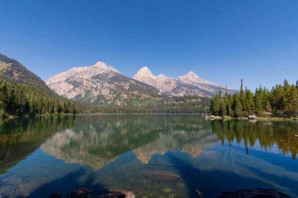 istock Grand Teton Mountain Range as seen from Bradley Lake 2195883486