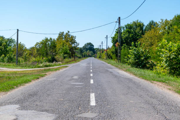 istock Asphalt road in the countryside 2195886028