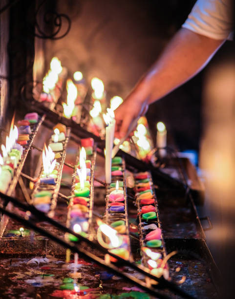 Burning candles inside Binondo church.