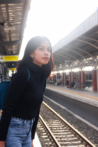 istock Excited Solo Traveler Waiting at the Train Platform 2195892013