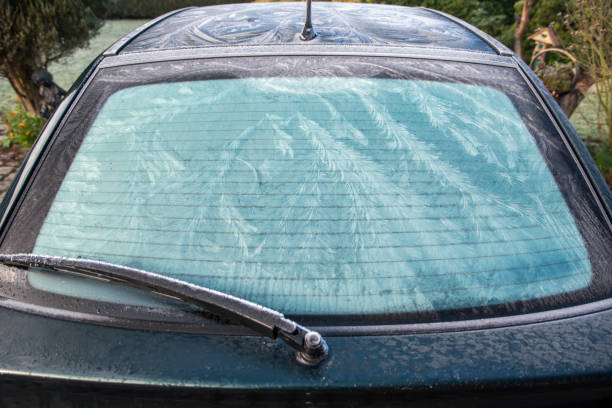 istock Nature draws frost patterns on glass when air temperature is below zero, abstract winter pattern on rear window of car 2195893138