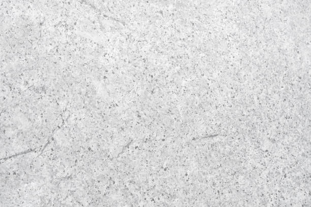 istock Empty light grey rough stone wall with black spot for abstract  background and texture. beautiful patterns, space for work, banner, wallpaper close up. 2195893988