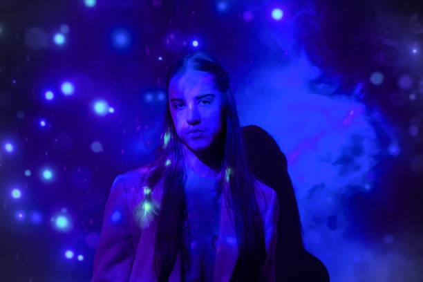 istock Girl under neon lights 2195895264