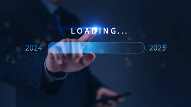 istock A hand pointing at a loading bar with a transition from 2024 to 2025 strategic planning, symbolizing progress and the future. 2195895704