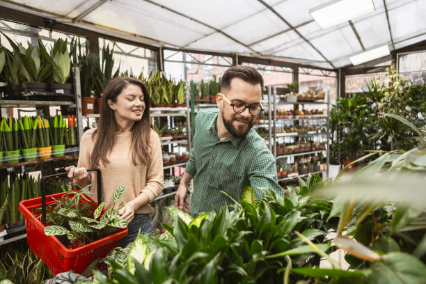 istock Loving Couple Enjoying a Relaxing Day Picking Out Plants 2195898732