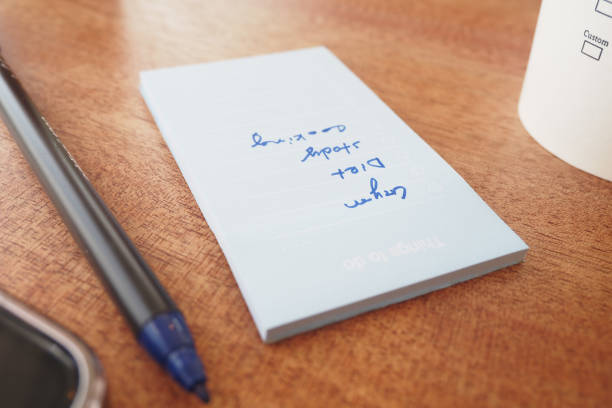 Light blue coloured adhesive note left blank for your own message